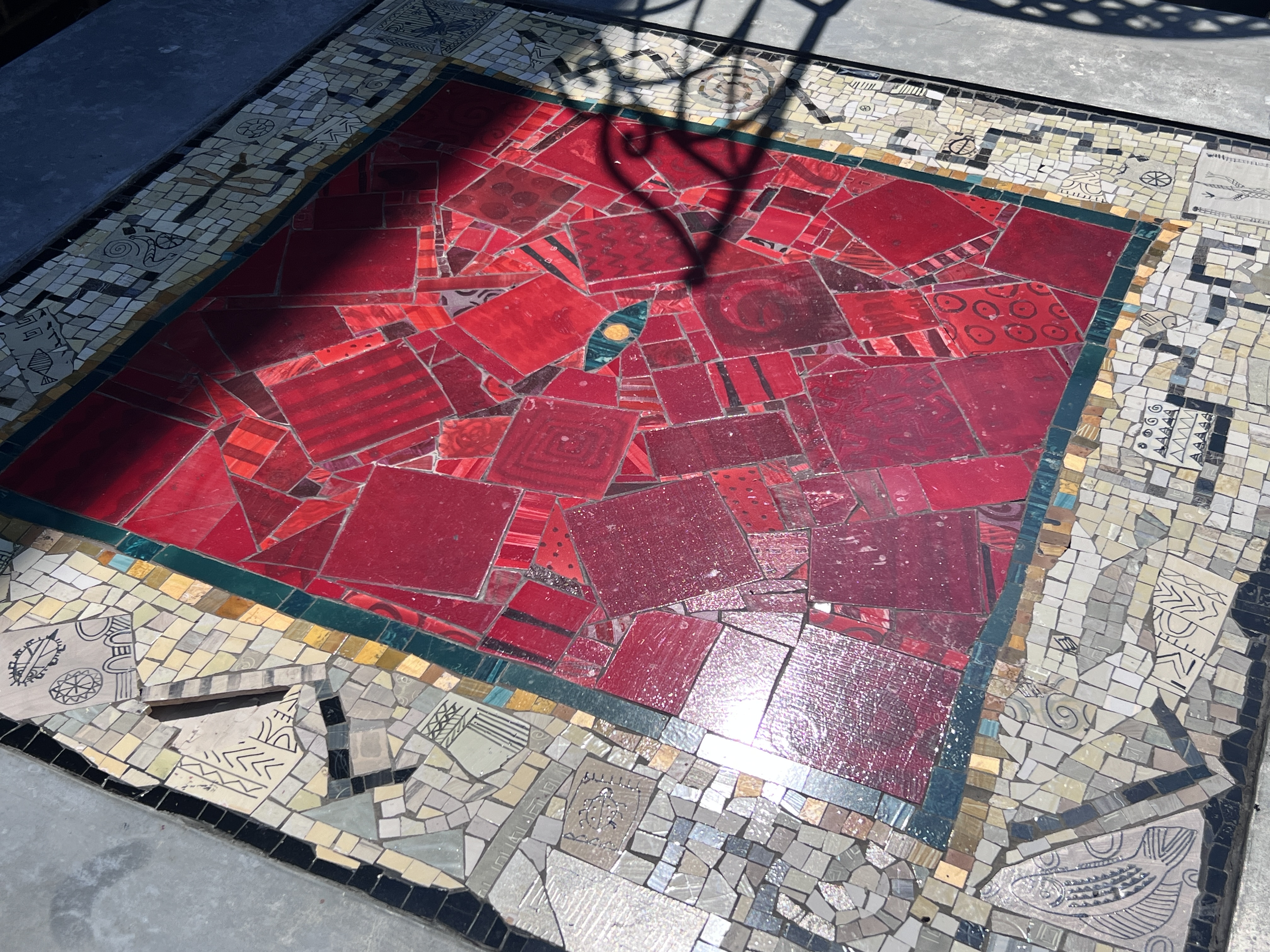 A square mosaic topped zinc garden table, width 122cm, height 77cm